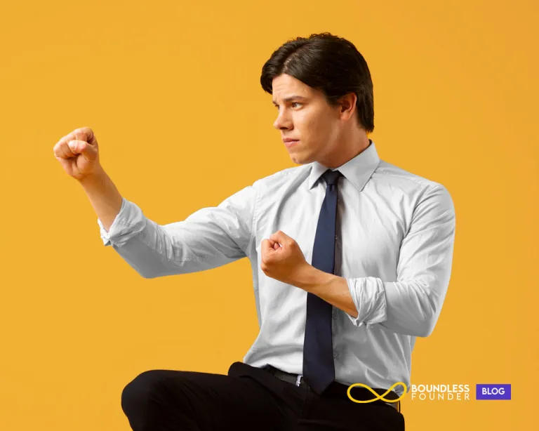 Business owner reflecting at desk after a workout, highlighting the link between physical health and clear decision-making.